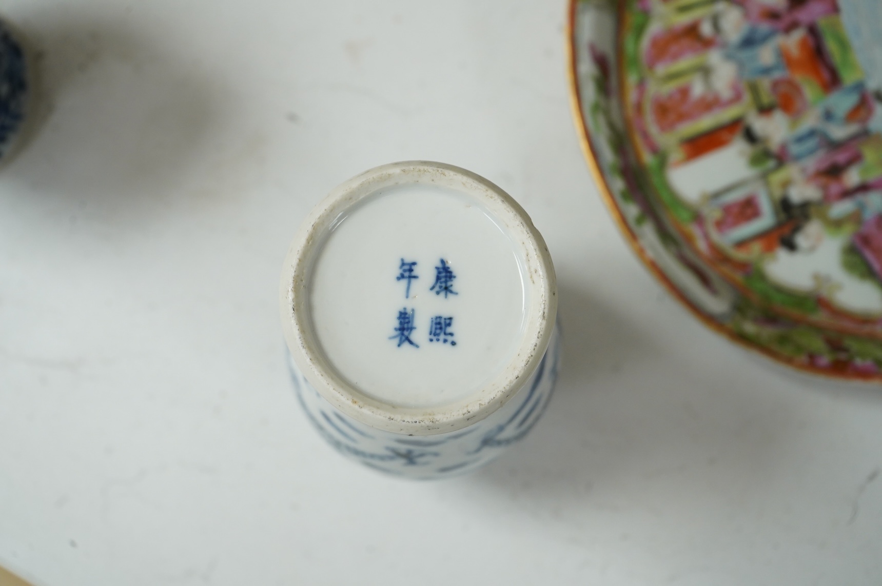 A collection of 19th century Chinese porcelain to include a pair of famille rose candlesticks, dish and a pair of blue and white baluster vases and covers